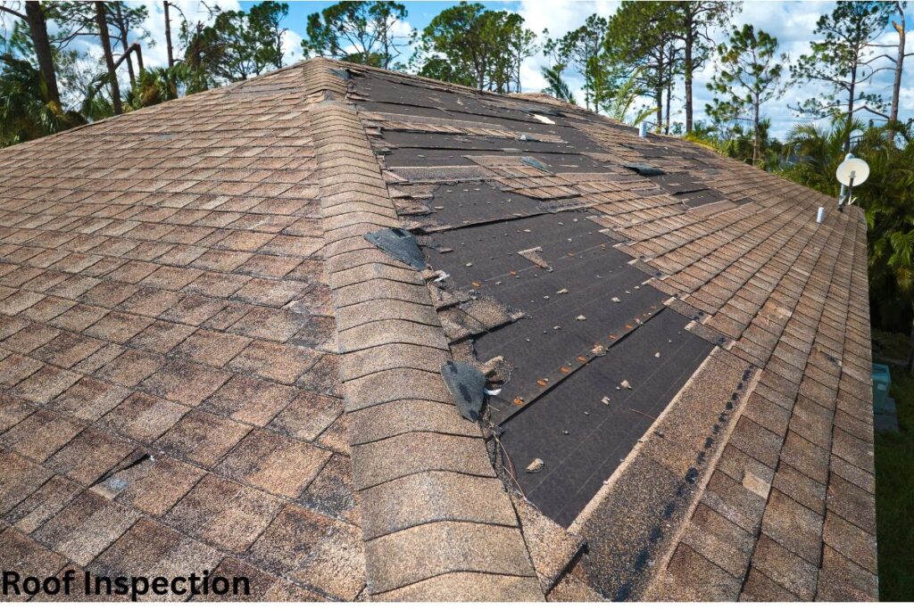 A roof with some shingles broken to describe on House Roof Inspection